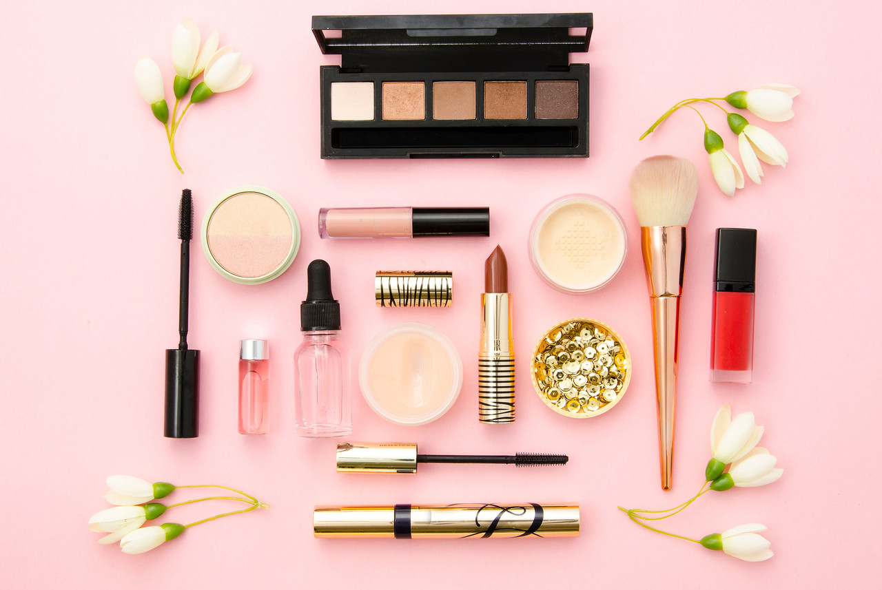 Eyeshadow palette, lip colors and base makeup products